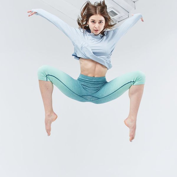 Person in mid-motion during a dynamic cardio exercise.